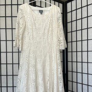 White midi length fit and flare lace bell sleeve dress
